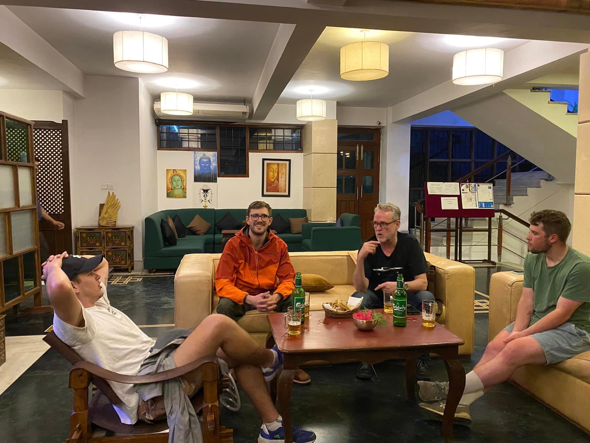 Guests relaxing on sofas in the hotel lobby